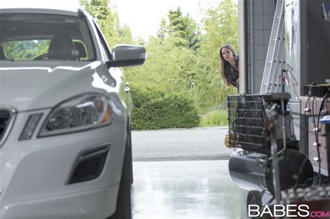 slutty brunette is getting fucked in car garage photos