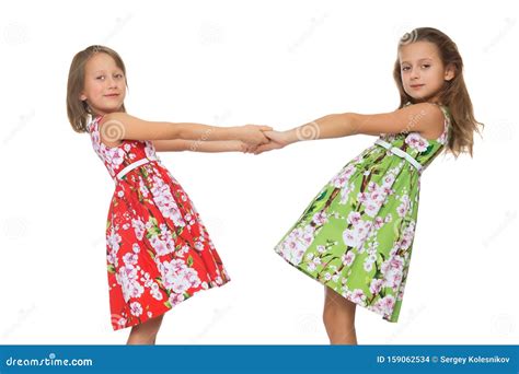 girls holding hands isolated  white background stock photo image