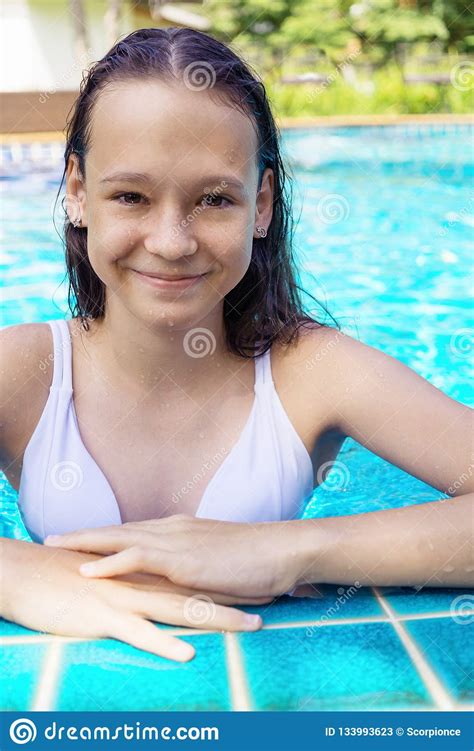 Cute Smiling Preteen Girl At Swimming Pool Edge Travel