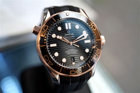 omega seamaster diver  sedna gold  master  axial black dial  mm thai ad