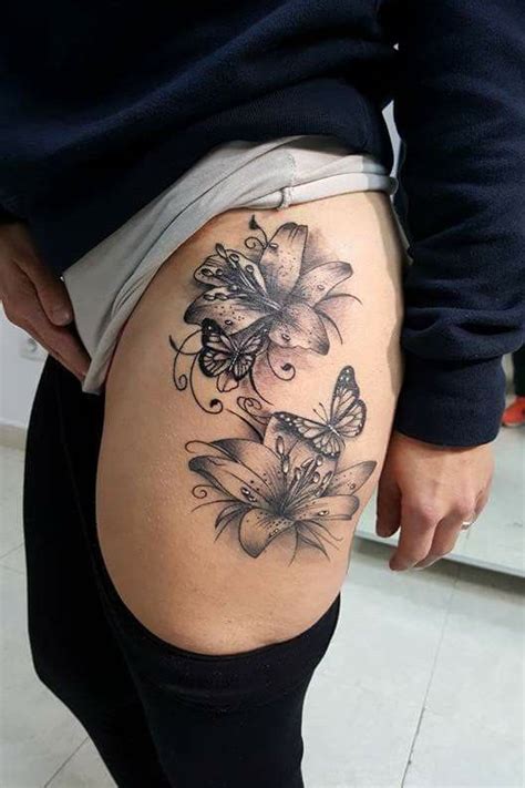 butterfly and flower tattoos on leg