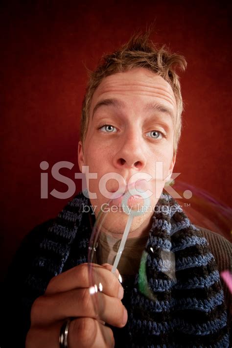young man blowing  bubble stock photo royalty  freeimages