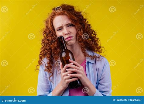 Curly Redhead Ginger Woman Drinking Beer And Feeling Bad Mood In Csudio