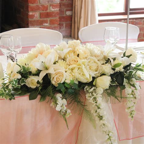 long   floral arrangement  expectations weddings