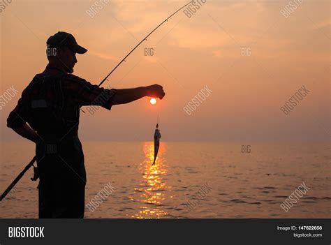 fisherman caught fish image photo  trial bigstock