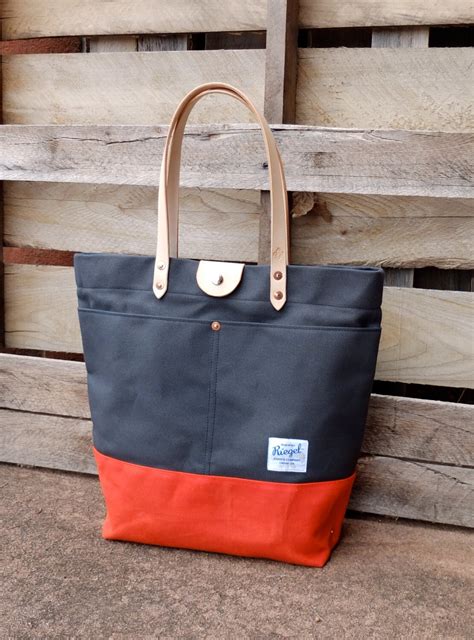 waxed canvas tote bag  leather handles  snap closure