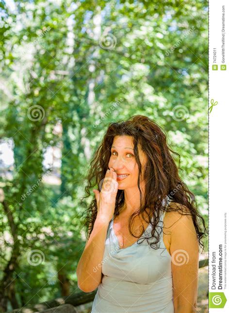 busty classy mature woman covering her mouth stock image image of