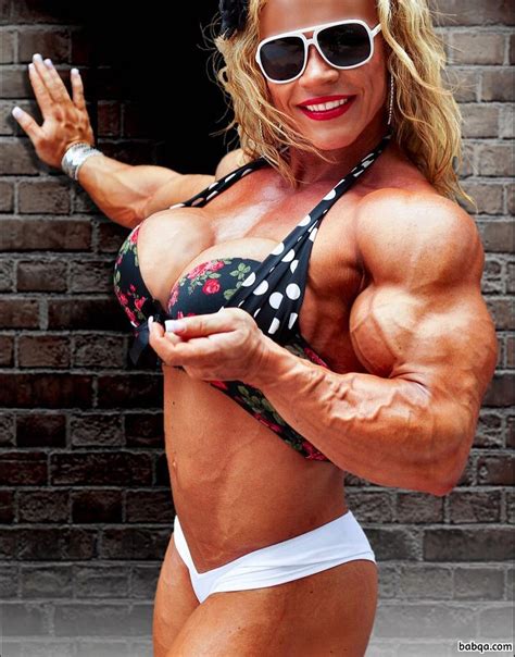 beautiful female bodybuilder with fitness body and toned