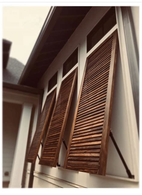 bahama shutters  installed   custom home yesterday love  color   cypress