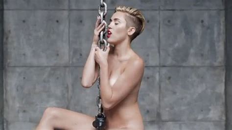 miley cyrus trades twerking for riding naked on wrecking balls and