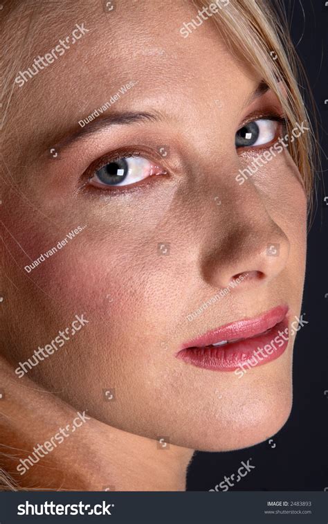 Closeup Picture Of A Beautiful Blond Face Looking At The