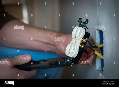 electrician wiring  electrical receptacle wall socket stock photo alamy