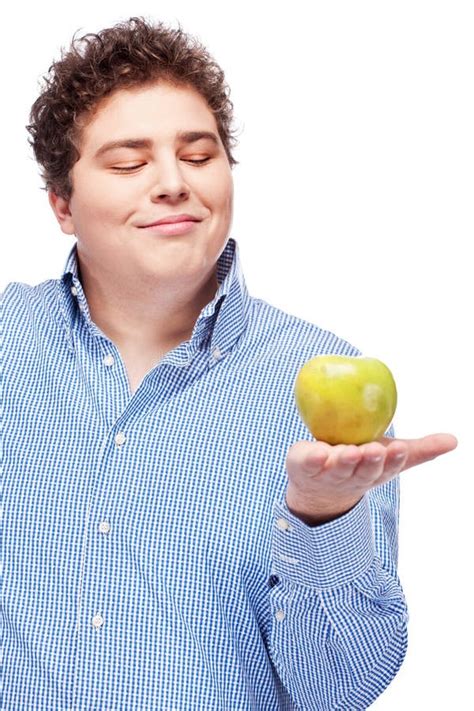 chubby man holding apple stock image image  food isolated