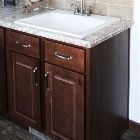 utility sink  base cabinet modular homes  manorwood homes