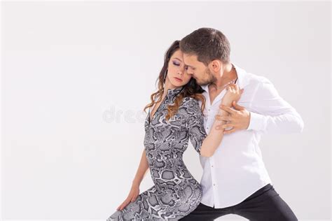 social dance bachata kizomba zouk tango concept man hugs woman