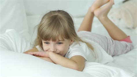 girl lying on bed stock video footage 4k and hd video clips shutterstock