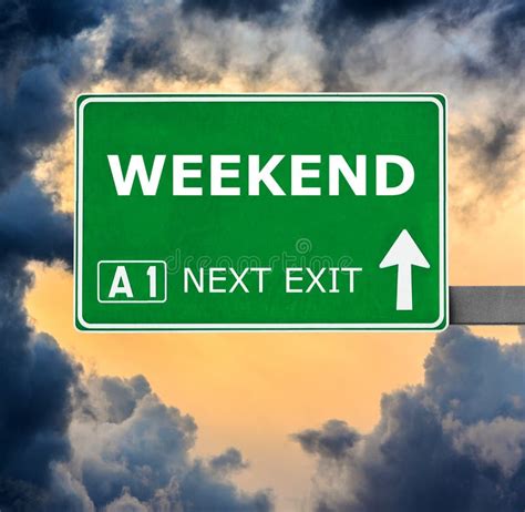 weekend road sign  clear blue sky stock photo image