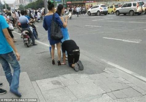 Shocking Moment A Woman In China Takes Her Male Companion For A Walk On