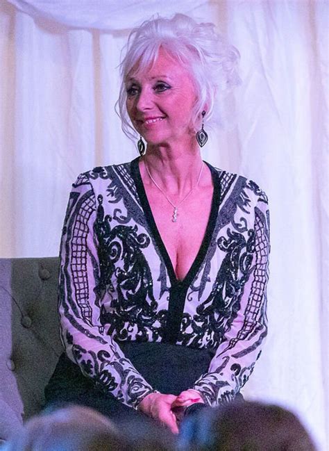 debbie mcgee steps out in cleavage baring look to remember late husband
