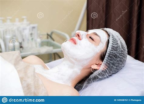 face mask spa beauty treatment young beautiful girl applying facial