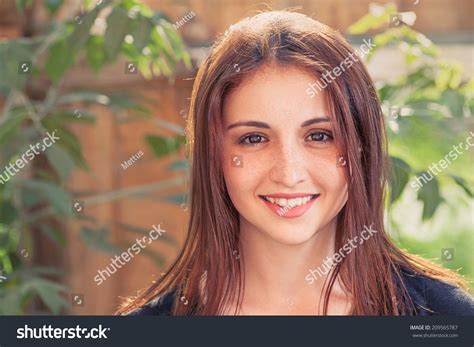 smiling redhead teen front view closeup image of a