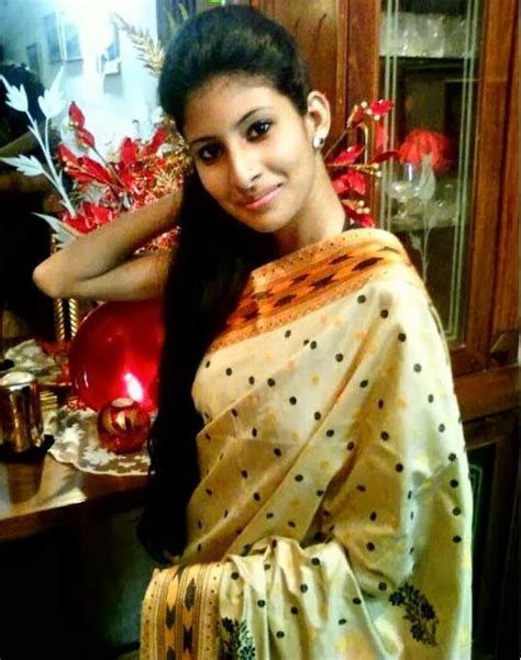 single cute assamese girl wearing traditional dress in saraswati puja