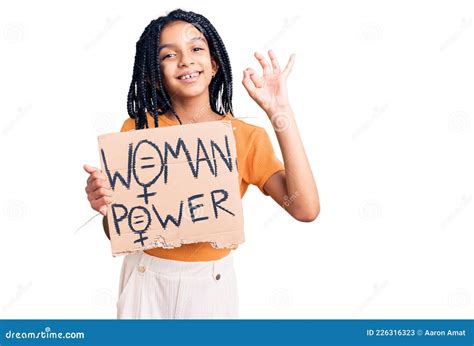 Cute African American Girl Holding Woman Power Banner Doing Ok Sign