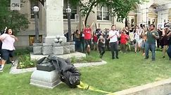Protesters tear down Confederate monument