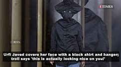 Urfi Javed covers her face with a black shirt and hanger; troll says 'This is actually looking nice on you!'