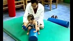Facilitation of trunk control & sitting balance for ataxic CP child