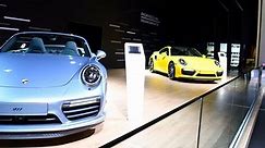 Porsche 911 Turbo and 911 Turbo S Cabriolet sports cars on display at the 2018 European motor show in Brussels.