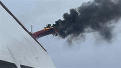 'Why is our tail on fire': Passenger records carnival cruise ship on fire