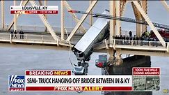 Semi-truck hangs off a Kentucky bridge, rescuers save driver