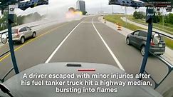 Fuel tanker hits highway median and bursts into flames