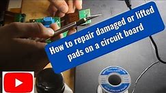 Repairing damaged or lifted pads on a circuit board