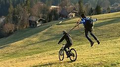 Creative, adrenaline junkie hooks his cycle to dad's paraglider for a CRAZY stunt