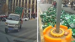 Clumsy driver spills hundreds of cases of beer making sharp turn