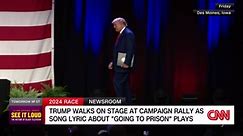 Trump walks onto rally stage as song lyric 'going to prison' plays