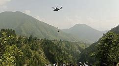 Children saved from dangling cable car in Pakistan