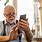 Old Man Holding an iPhone