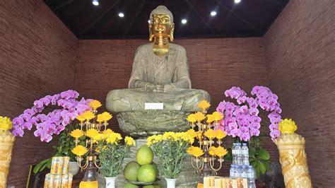 Seeking refuge in the sacred space beside the Tuong Long Tower relic.