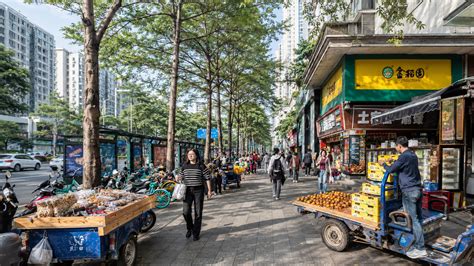 A hidden urban rhythm moves through this Chinese neighborhood street