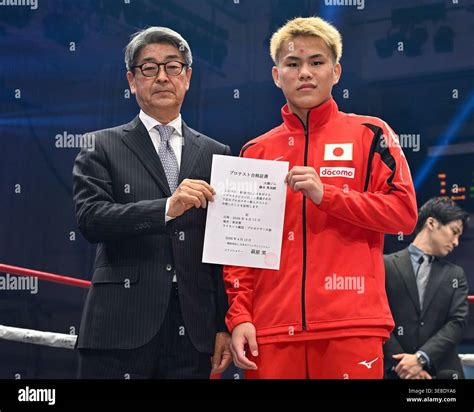 Yuga Fujiki (R) and Japan Boxing Commission (JBC) Commissioner Minoru Hagiwara during the test ...