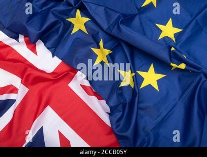 United Kingdom and European Union flags waving on isolated white ...