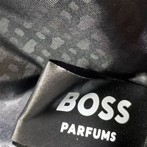 black BOSS Menswear belt bag featuring a silver Double B monogram