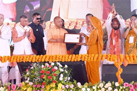 CM Yogi distributes cheques, approval letters and toolkits to ...