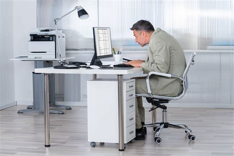What 10 Years of Sitting at a Desk Job Does to Your Body - AOL