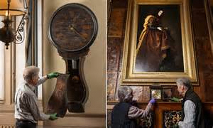 Don't forget! Volunteers adjust historic timepieces at country houses ...