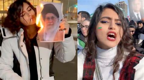 Woman who lit cigarette with burning Khamenei photo seen dancing after ...