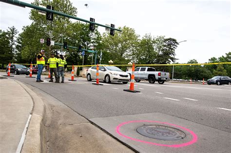 City crews begin manhole lid replacement project along Anderson ...